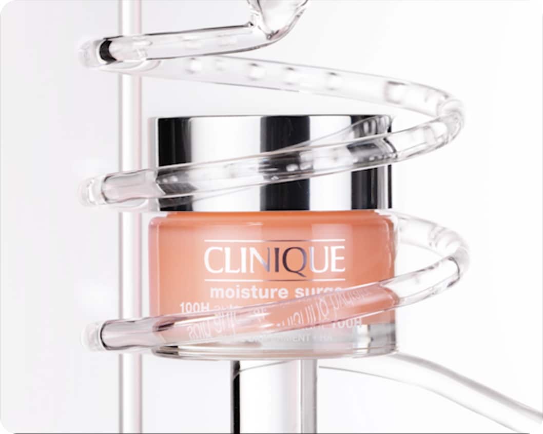 Close up of Moisture Surge 100H Hydrator in front of animated lab glassware, in a brightly lit setting